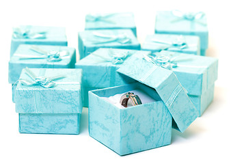 Image showing Cyan gift boxes with ring