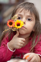 Image showing Little girl with flower