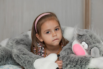 Image showing Girl with cat soft toy