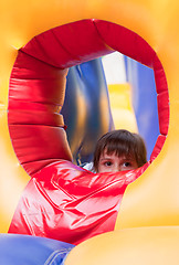 Image showing Little girl on inflatable slide