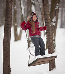 Image showing Young girl on a swing