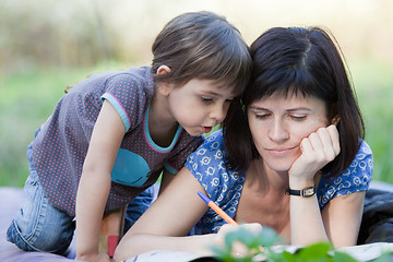 Image showing Mother and daughter playing outdoors