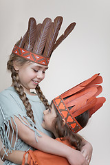 Image showing Two little girls playing Indians