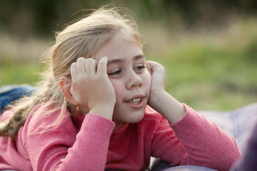 Image showing Young girl resting