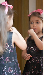 Image showing Portrait of little girl reflected in mirror