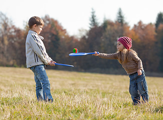 Image showing Kids playing tennis outside