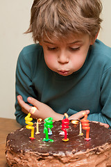 Image showing Cute boy at birthday cake