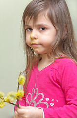 Image showing Little girl with pussy willows