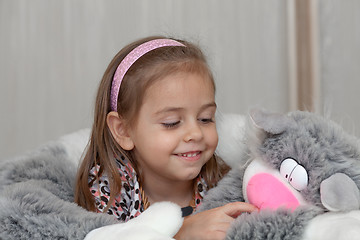 Image showing Girl with cat soft toy