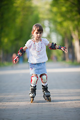 Image showing Little girl on roller skates