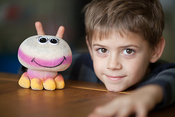 Image showing Smiling Boy and Alien Toy  with Antennas