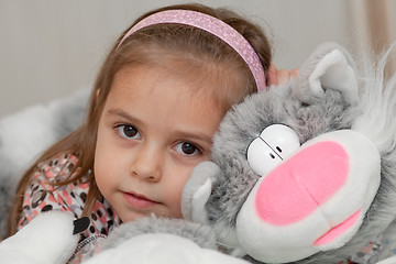 Image showing Girl with cat soft toy