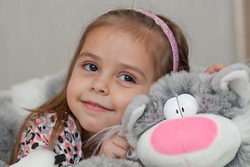 Image showing Girl with cat soft toy