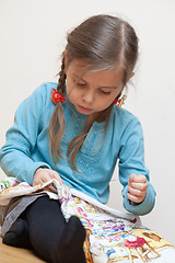 Image showing Little girl embroidering