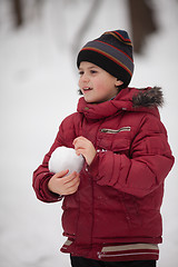 Image showing Boy with  snowball