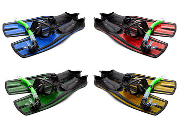 Image showing Set of multicolored mask, snorkel and flippers with water drops