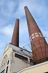 Image showing industrial building and two brick chimney 