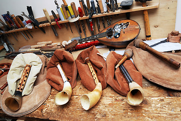 Image showing workplace musical masters, bagpipes, mandolin, tools