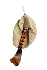 Image showing close-up of  antique bagpipe over white background