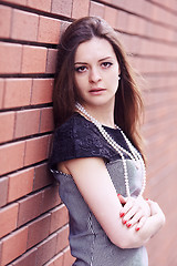 Image showing Girl near the wall