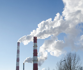 Image showing smoke rise industry factory chimneys heat blue sky 