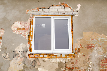 Image showing renovation plastic window old brick house wall 