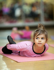 Image showing Little girl stretching