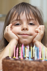 Image showing Smiling girl and birthday cake