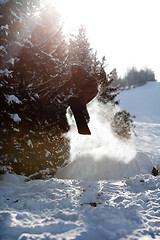 Image showing Man snowboarder jumping