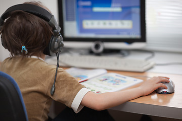 Image showing Kid working with  computer