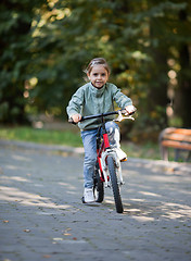 Image showing Little girl riding bike