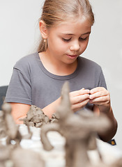 Image showing Little girl sculpts