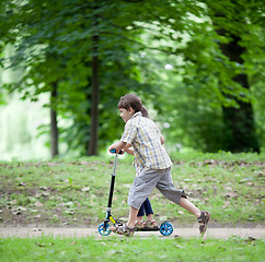 Image showing Enjoying balancing a scooter