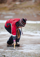 Image showing Cleaning  the ice from snow on rink