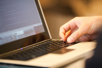 Image showing Using laptop