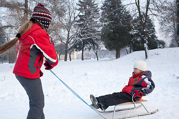 Image showing Children having fun in winter park