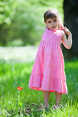 Image showing Beautiful little girl and tulip