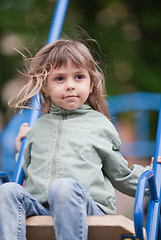 Image showing Little girl on a swing