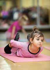 Image showing Little girl stretching