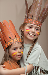 Image showing Two little girls in Indian's dresses