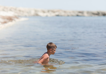 Image showing Little boy in the sea
