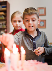 Image showing Lighting the birthday candles