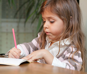 Image showing Little girl drawing