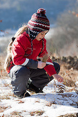 Image showing Child on the meadow in winter