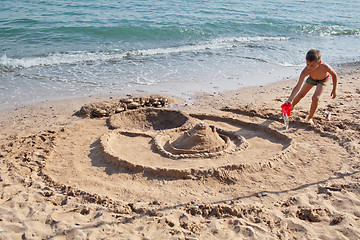 Image showing Building sand castle