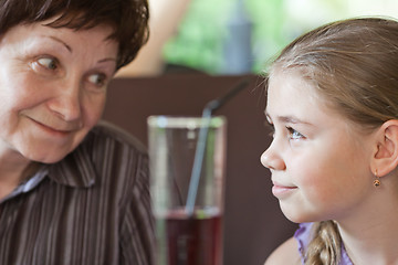 Image showing Grandma smiling to her granddaughter 