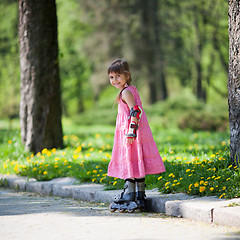 Image showing Little girl on roller skates