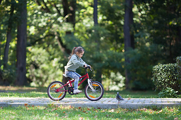 Image showing Little girl riding bike