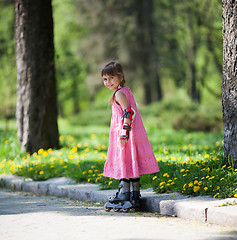 Image showing Little girl on roller skates