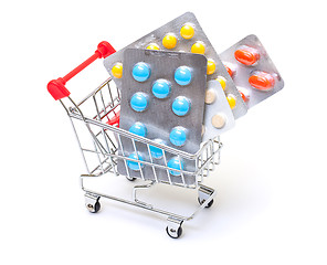 Image showing Multicolored pills packs in shopping cart